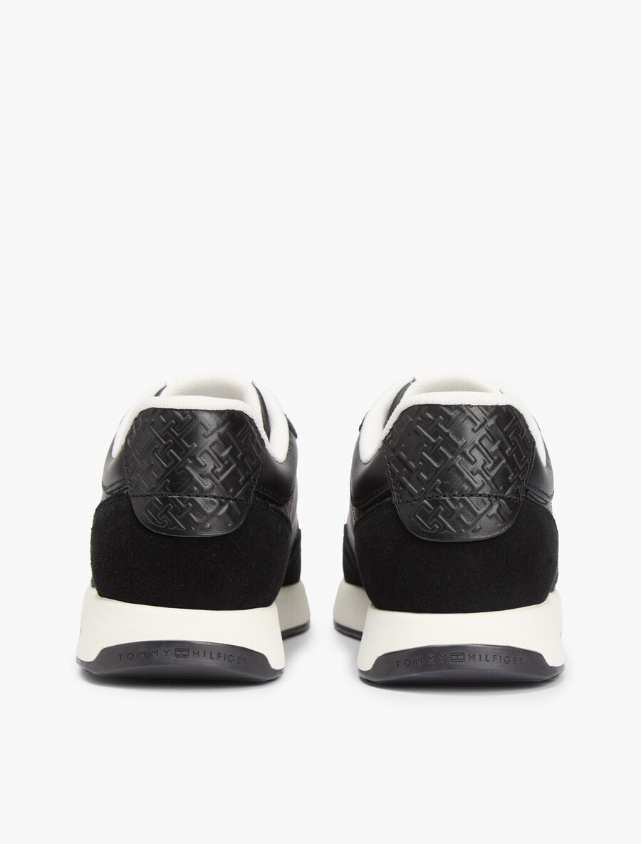 sneakers in pelle con monogramma th in rilievo