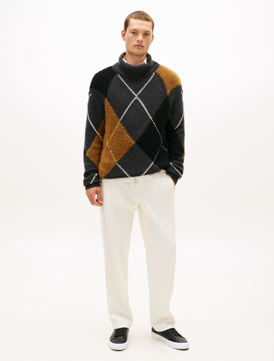 sneakers in pelle con intersuola a contrasto e stampa goffrata